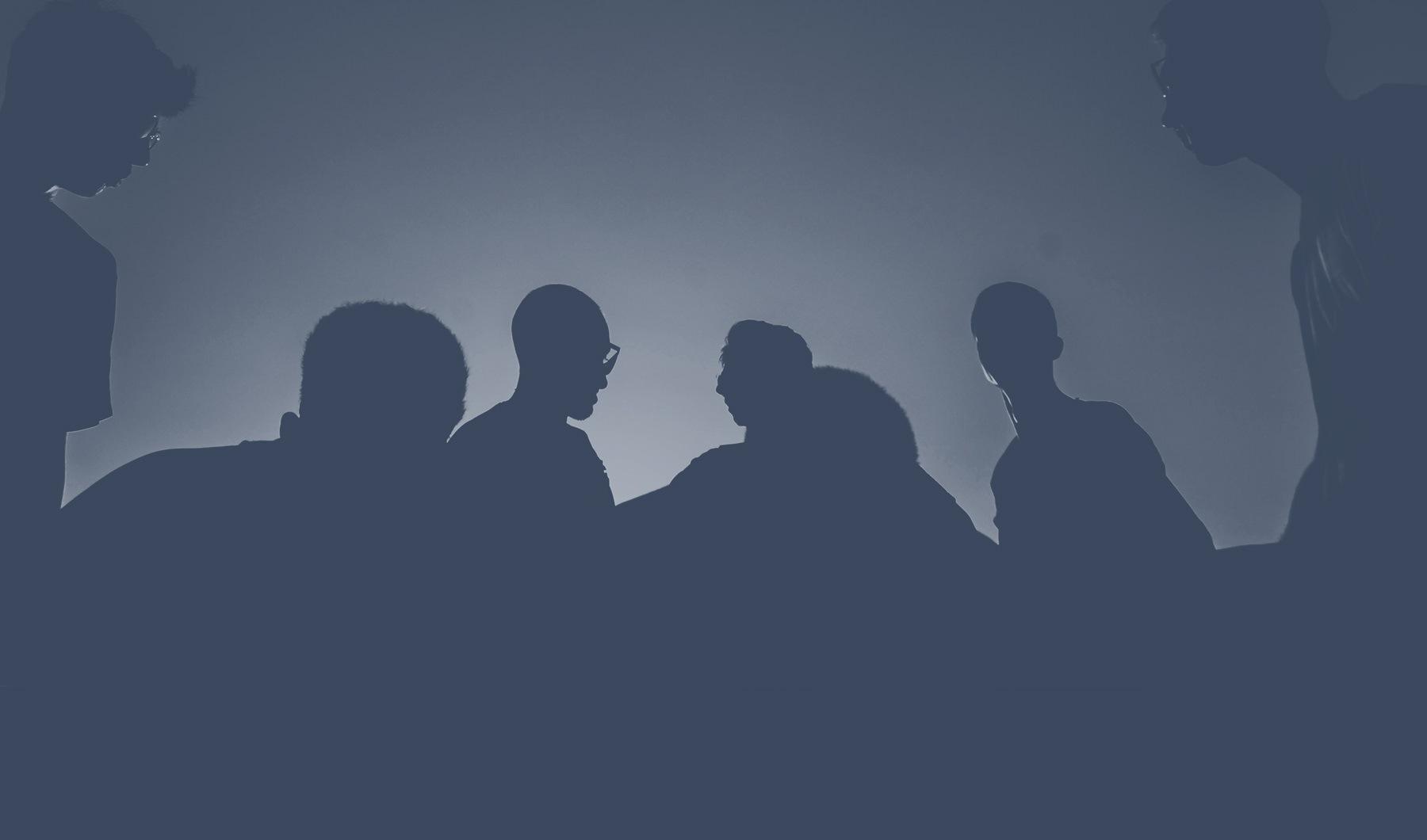 Silhouette of people standing together